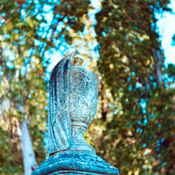 An urn on a gravestone marker.